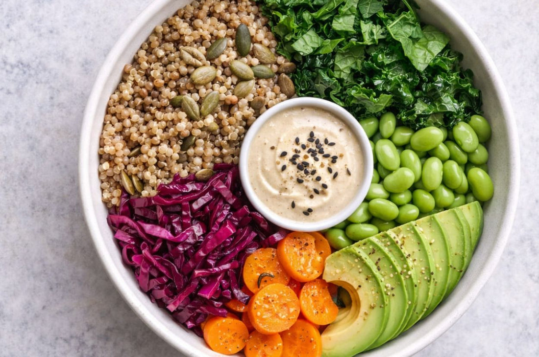 Top-down plant-based grain bowl with creamy seed dressing