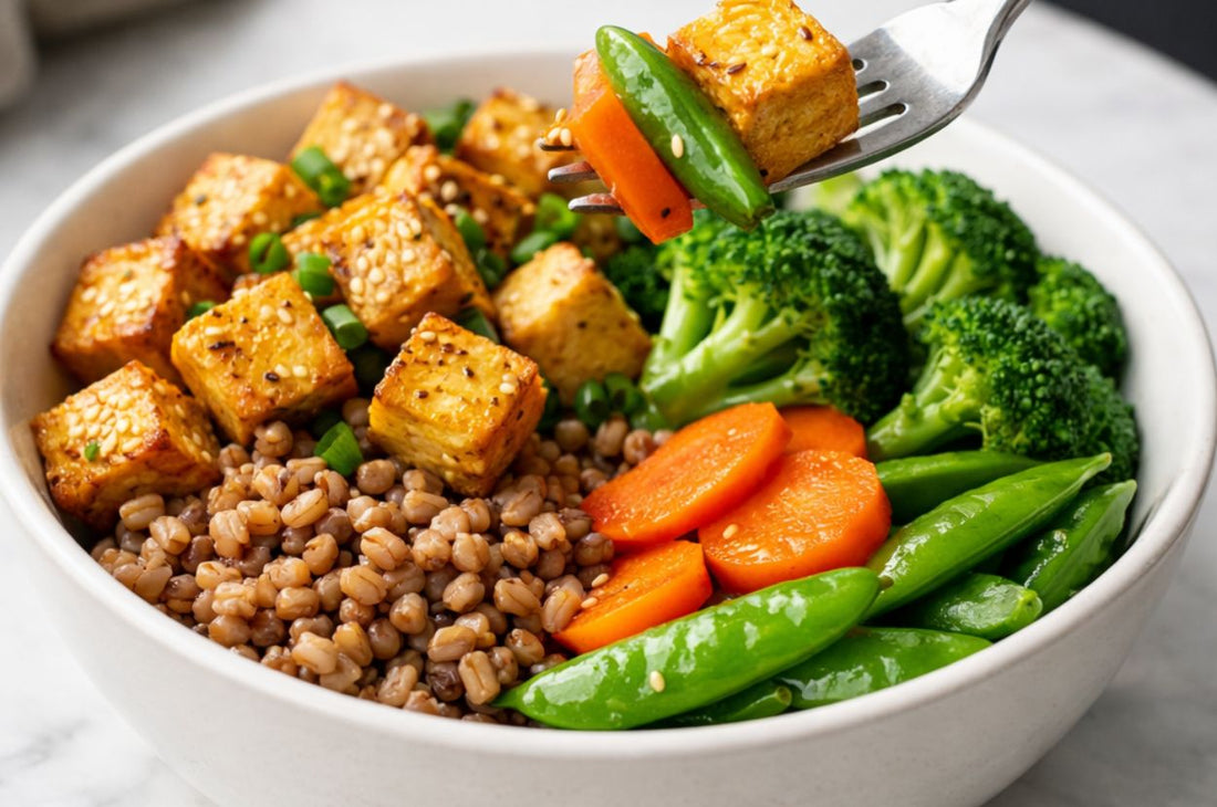 A bowl of vegetarian protein packed meal with tofu, broccoli and grains