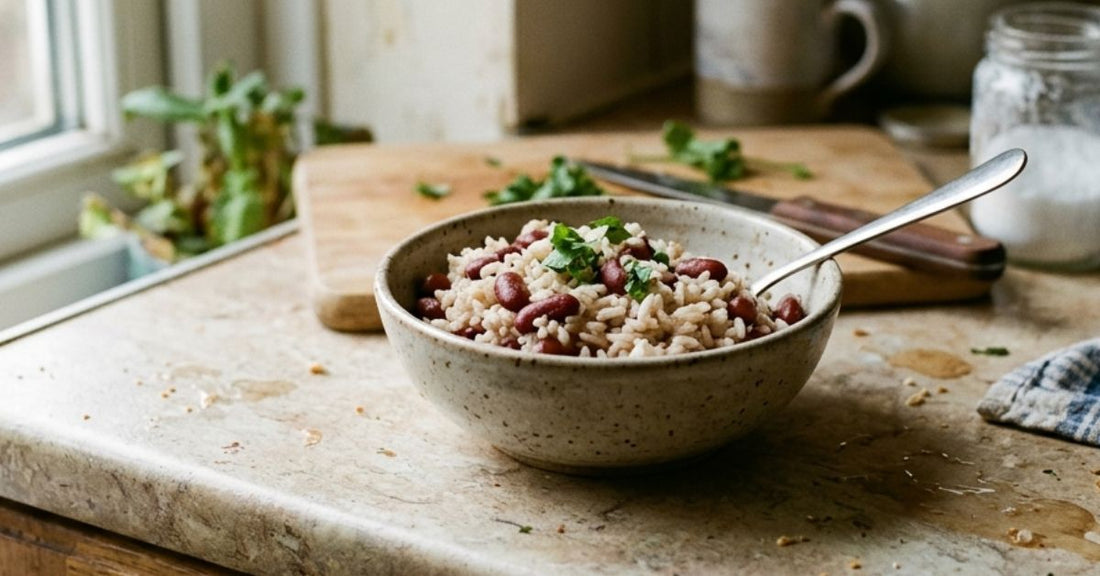 Small bowl of rice and beans on a slightly messy kitchen counter